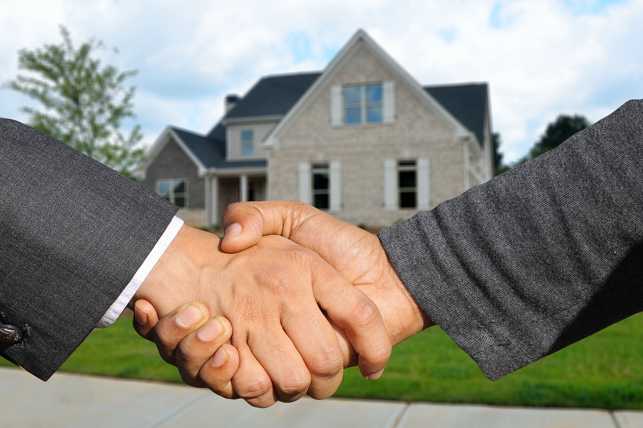 Property manager handing residents the keys to their rental home