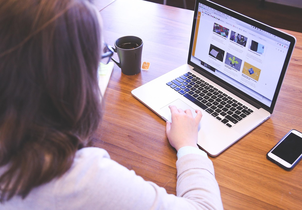 Property manager publishing rental home listings from a laptop